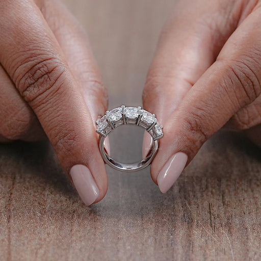 close view of radiant cut lab diamond five stone wedding ring with white gold band