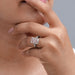 pink radiant-cut lab diamond three-stone colored engagement ring on model's finger
