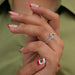 In finger side look of princess cut lab diamond engagement ring with double halo setting