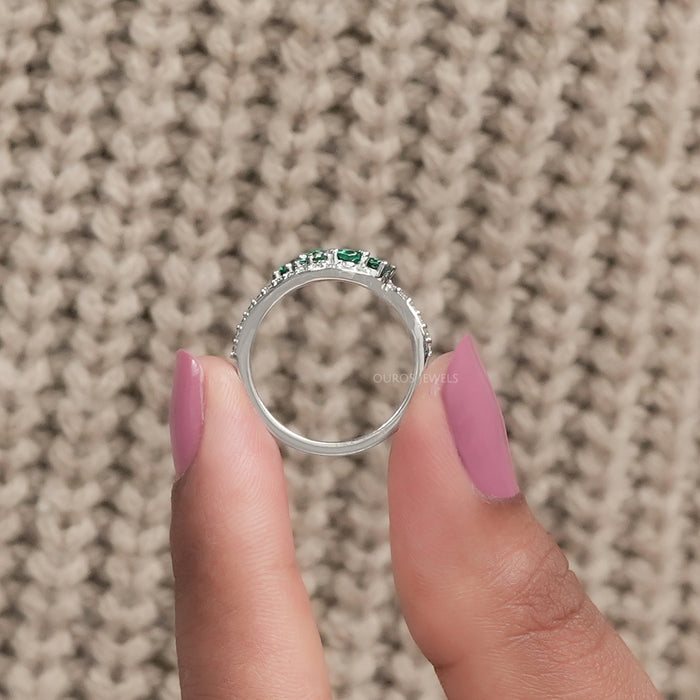 green gemstone and diamond bypass ring 