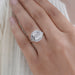 square old mine cushion lab diamond halo engagement ring in finger