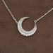 front view of round cut diamond milgrain bezel set moon pendant necklace