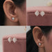 round diamond and marquise cluster studs