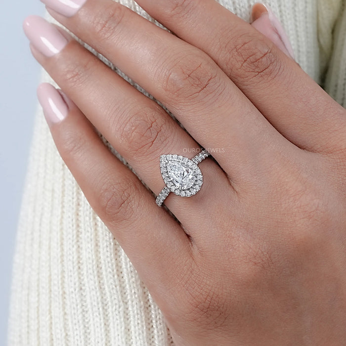 pear cut lab diamond halo eternity wedding ring on model's hand