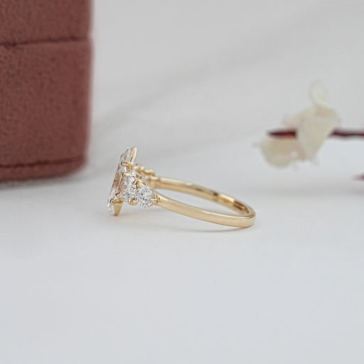 side view of marquise and round cut lab diamond five stone engagement ring