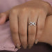 round-cut lab-grown diamond classic wear bow ring pink on model's finger