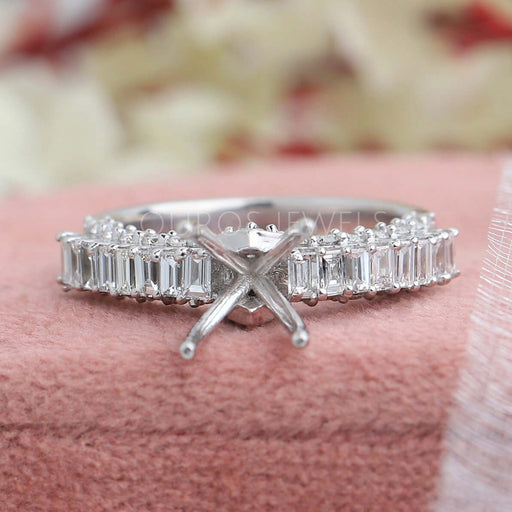 front view of baguette-cut accent diamond semi-mount engagement ring on jewelry box