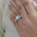 square old mine cushion diamond five stone halo engagement ring in finger