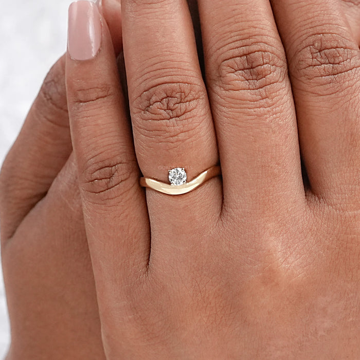 round cut lab diamond curved band wedding ring in finger