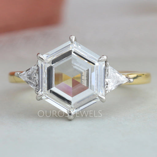 front view of step cut hexagon lab diamond three stone engagement ring