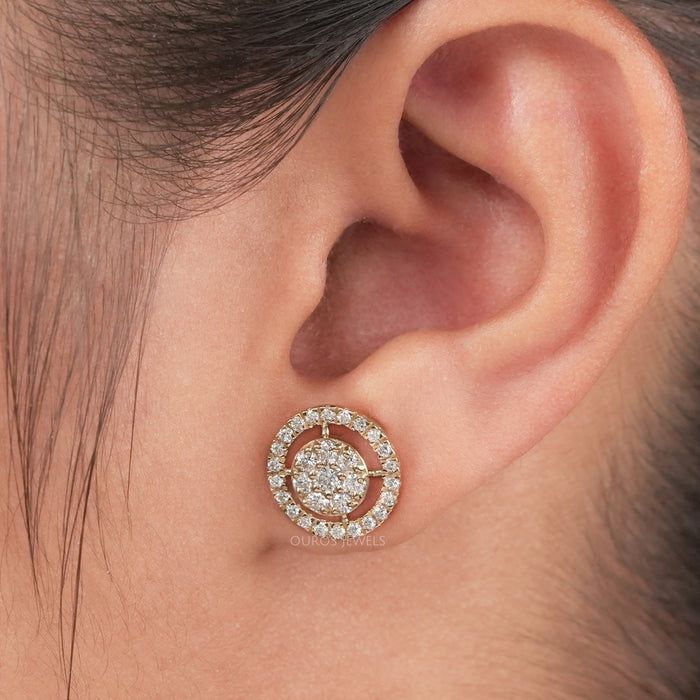 Round Brilliant Cut Diamond Halo Stud Earrings displayed on an ear, highlighting their intricate and sparkling design.