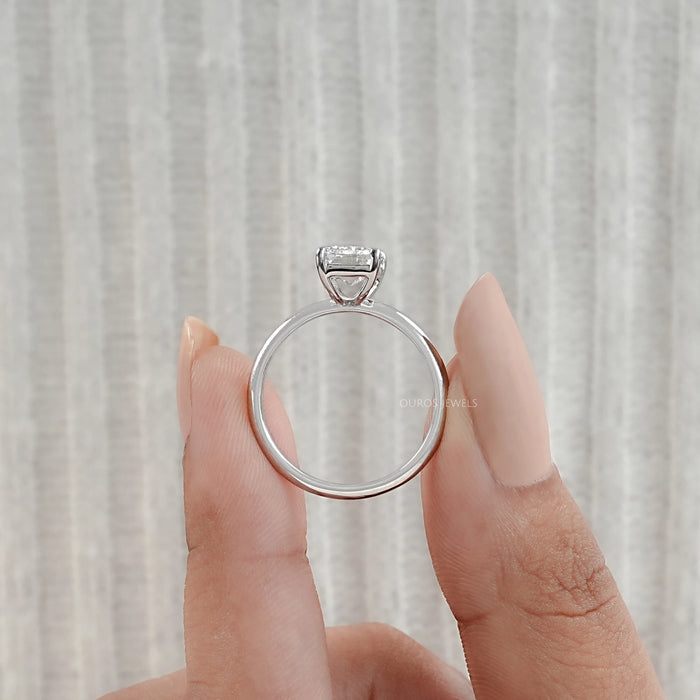 close view of emerald cut lab diamond solitaire engagement ring