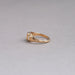 side view of yellow emerald-cut diamond 3 stone bezel set colored engagement ring
