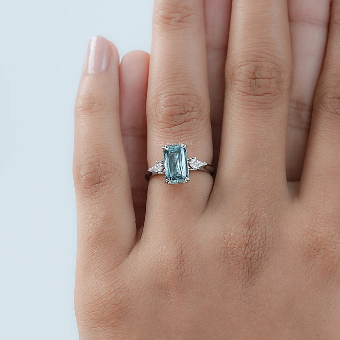 green scissors cut diamond double prong three stone wedding ring's top view in finger