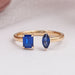 front view of two stone blue emerald and pear gemstone open cuff wedding band