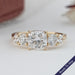 front view of cushion cut diamond five stone engagement ring in yellow gold band