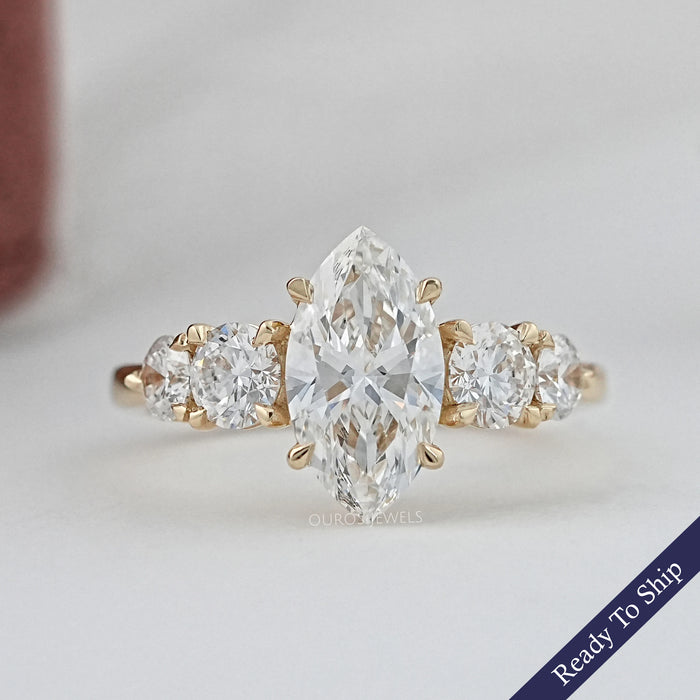 front view of marquise and round cut lab diamond five stone engagement ring