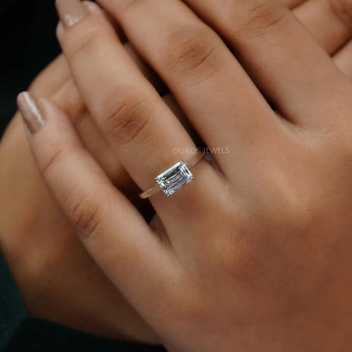 east west criss cut diamond engagement ring in model's finger