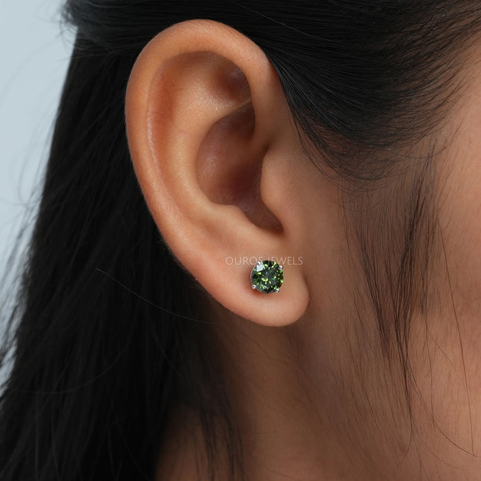 green round shape lab made diamond stud earrings white gold on ear