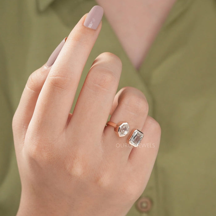 criss cut and step moval diamond bezel set toi et moi wedding ring on model's finger