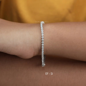 [A Women wearing 7 inch Round Lab Diamond Tennis Bracelet]-[Ouros Jewels]