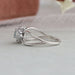 Side view of vintage asscher cut cluster diamond ring, this ring center diamond is Bluish Green.