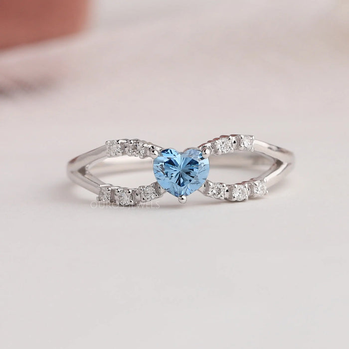 Created in 14K white gold, this design features a white diamond-accented infinity shape