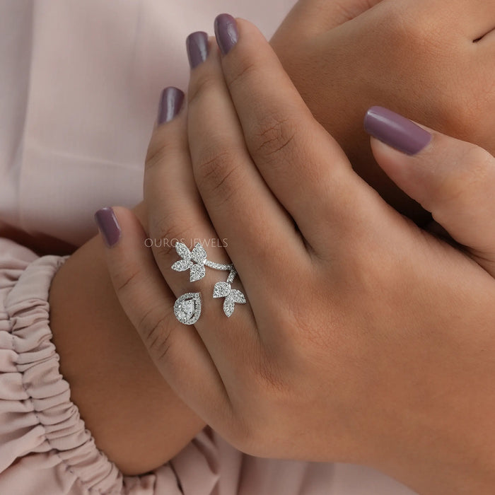 In finger front look of vintage pear diamond halo style open cuff ring in 14k white gold.  