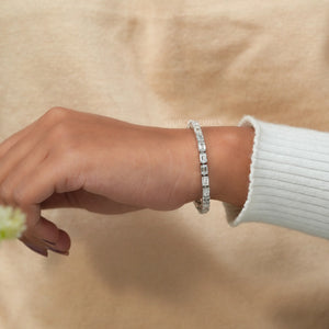 [A Women wearing Emerald Cut Diamond Tennis Bracelet]-[Ouros Jewels]