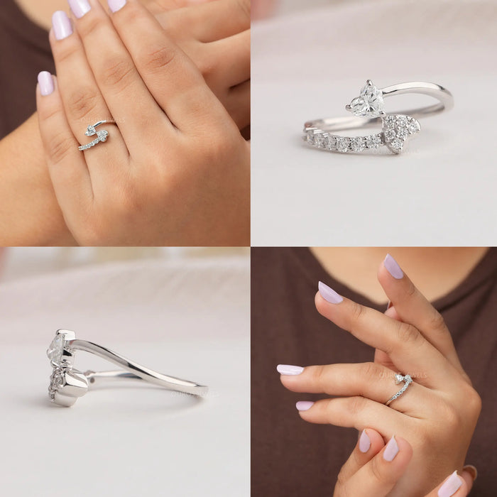 Heart bypass ring in 14k white gold and curved shank studded with round diamonds
