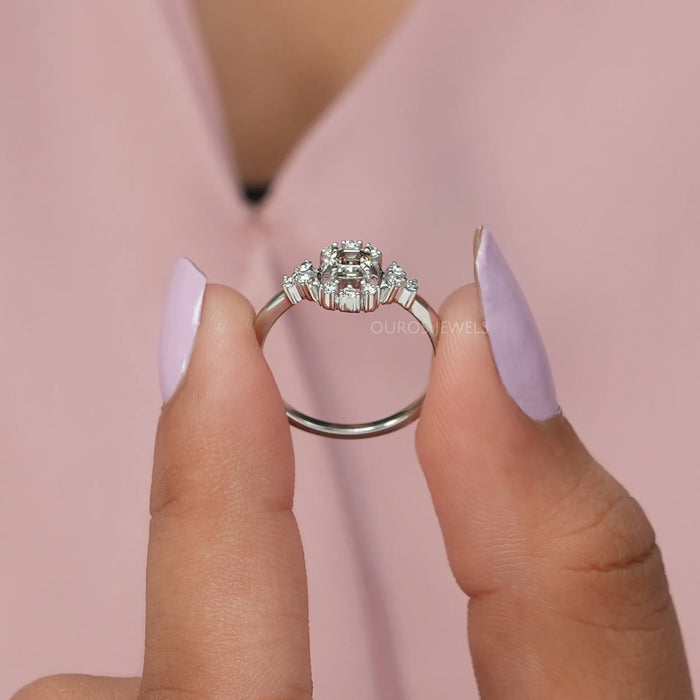 Round halo and accent stones studded on Asscher cut diamond engagement ring
