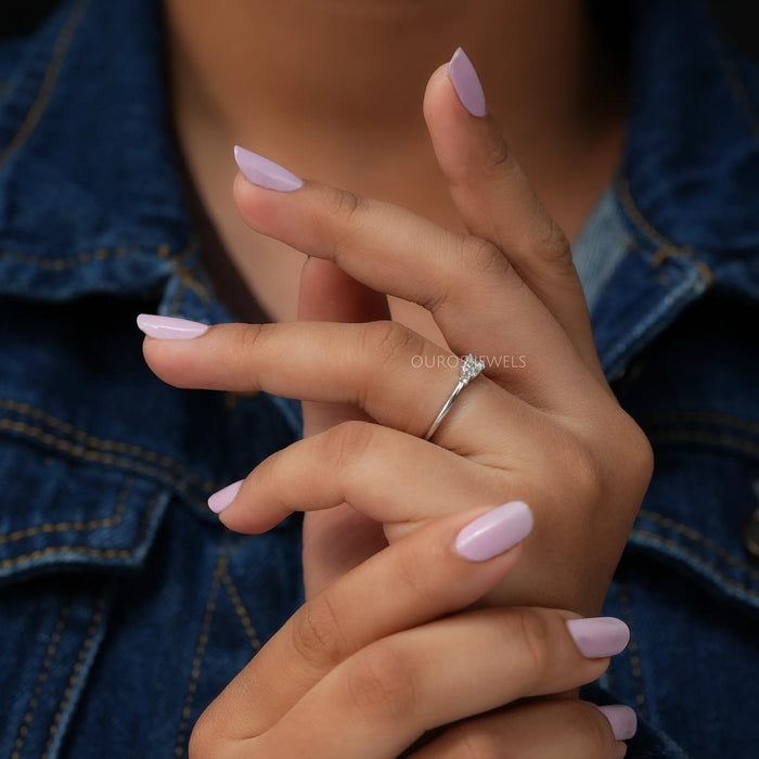 In finger view of lab made cluster diamond engagement ring   