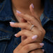 In finger view of lab made cluster diamond engagement ring   