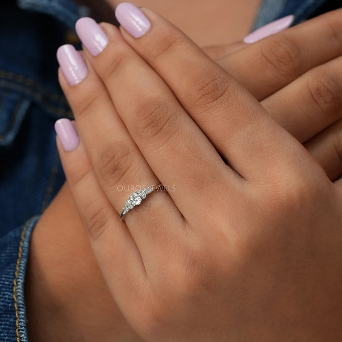In finger view of lab created oval shaped engagement ring 