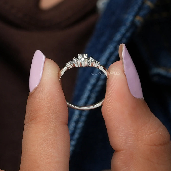 In finger side view of Cluster setting of oval cut diamond ring 