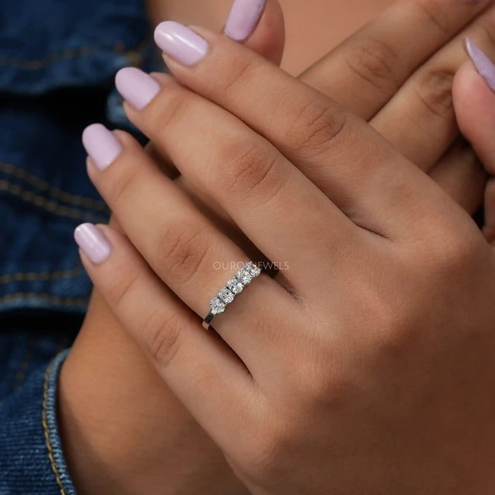 In finger front look of oval brilliant cut diamond five stone wedding ring