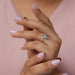 In finger side look of pear shaped lab grown diamond engagement ring