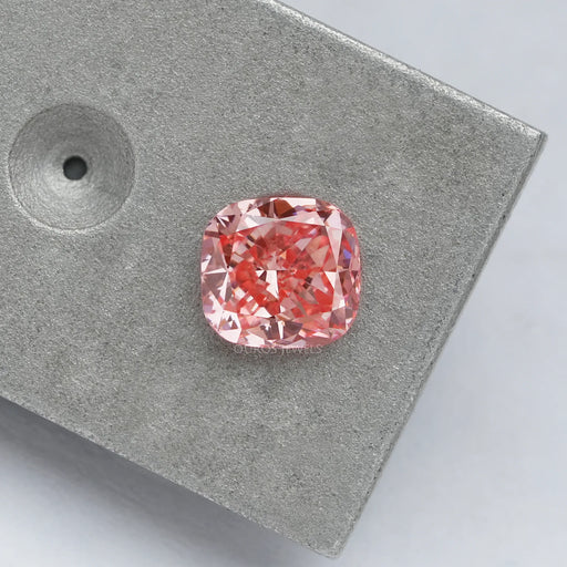0.6 carat pink lab created diamond cushion cut on matte material