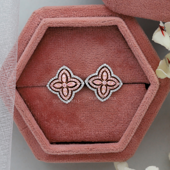 pink round cut man made diamond flower stud earrings on jewelry box