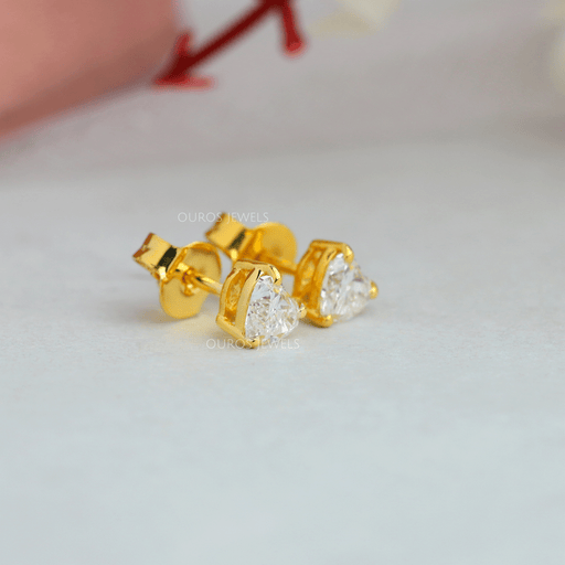 side view of heart shaped lab-grown diamond stud earrings gold