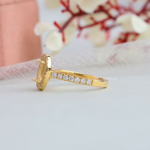 left side view of oval-shaped round diamond halo semi-mount engagement ring