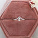 Pear shaped curved diamond wedding band in 14k white gold at Ouros Jewels