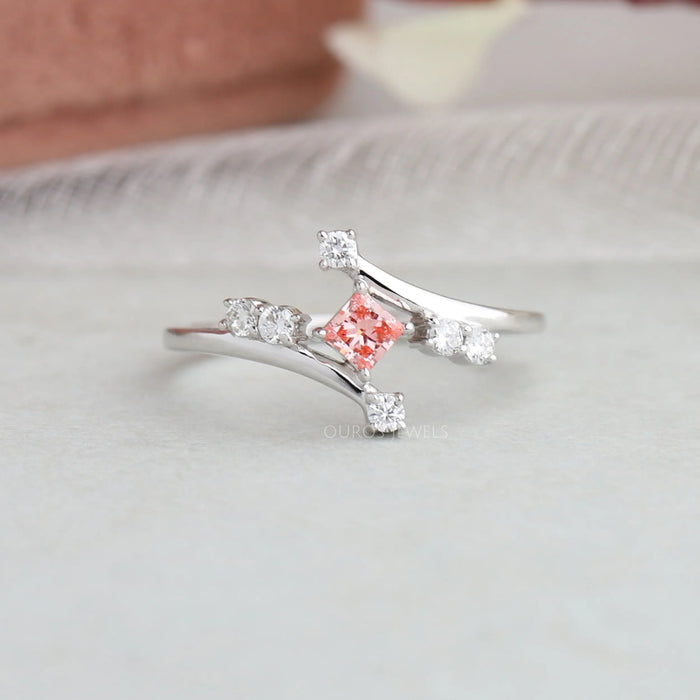 Pink princess and round lab diamond wedding anniversary ring with bypass setting and round accents
