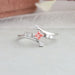 Pink princess and round lab diamond wedding anniversary ring with bypass setting and round accents