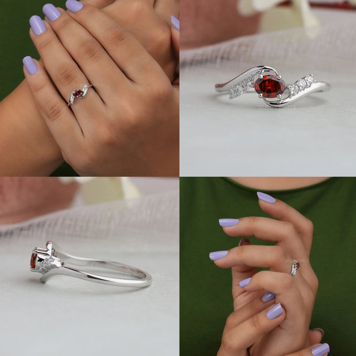 Crafted with precision, the bypass band design showcases a deep red oval diamond at its center, creating an elegant contrast against the bright white gold setting