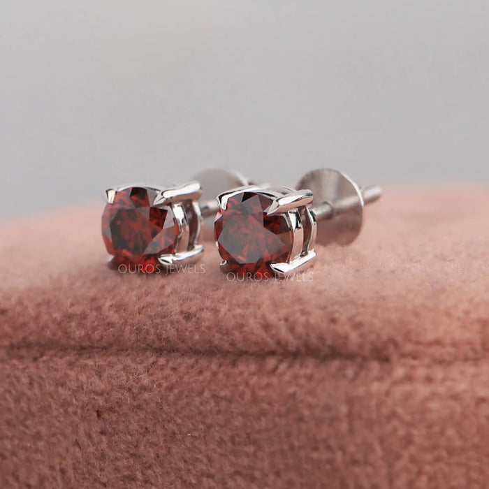 Shining fancy colored solitaire diamond earrings in solid white gold 