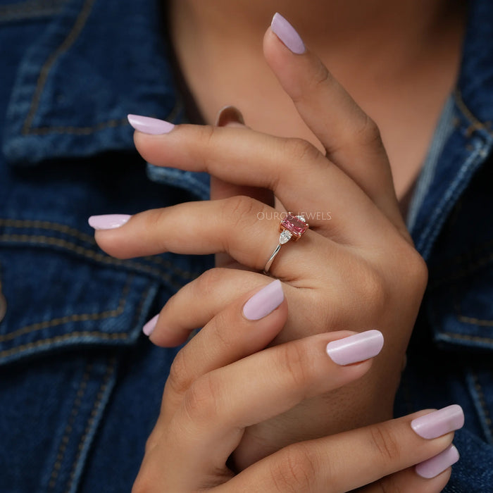 In Finger Side View Of 1 Carat Pink Radiant Cut Three Diamond Engagement Ring
