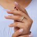 In finger side look of yellow cushion five stone diamond ring