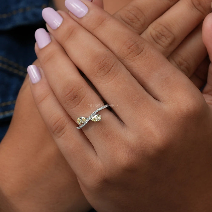 In Finger View Of Pear Shaped Yellow Diamond Bypass Engagement Ring