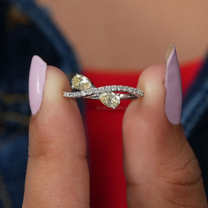 A Close Up Look Of Lustrous Yellow Colored Two Pear Stone Diamond Engagement Ring
